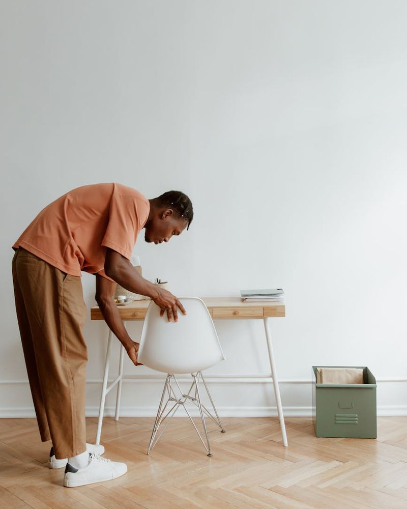 Person practicing eye exercises in a bright office space.